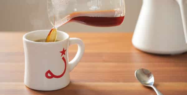 pouring coffee into mug