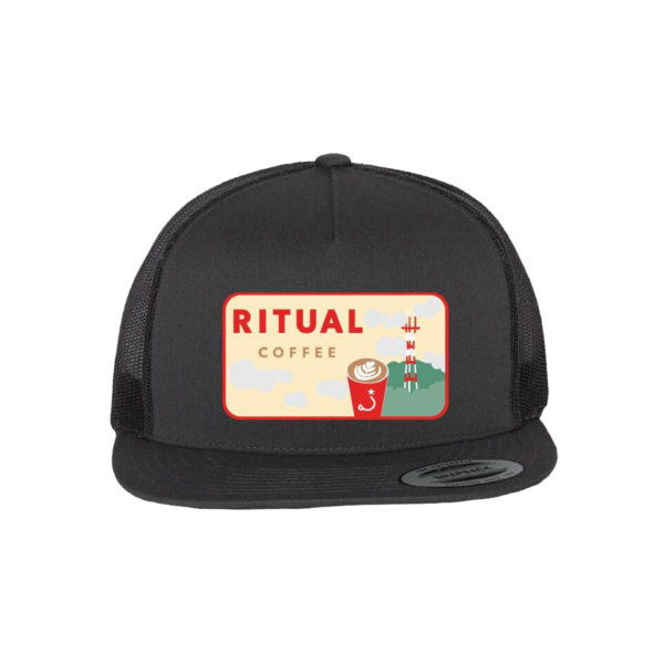 dark trucker hat with a designed embroidered patch.