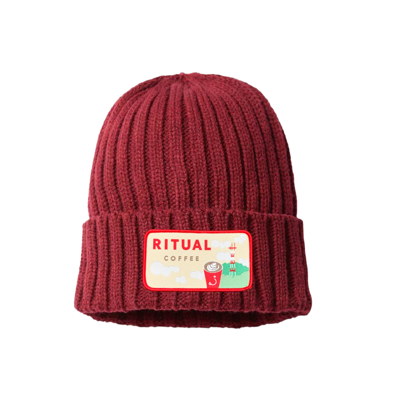 cable beanie with a designed embroidered patch.